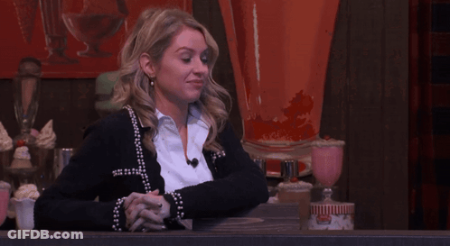 Woman In Black Cardigan With Folded Hands GIF