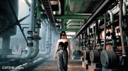 Woman In Black Corset Walking Through Green Pipes GIF