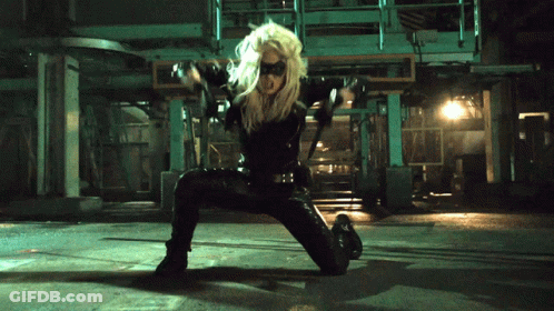 Woman In Black Costume Kneeling GIF