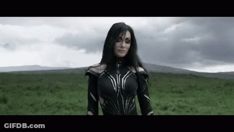 Woman In Black Costume Standing In Field GIF