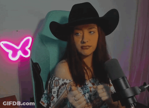 Woman In Black Cowboy Hat At Microphone GIF