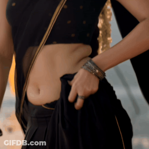 Woman In Black Crop Top And Black Skirt GIF