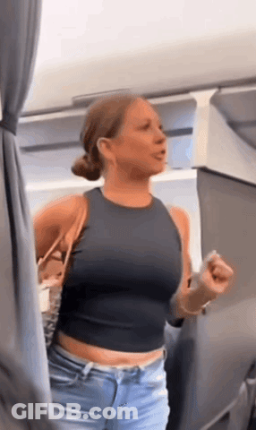 Woman In Black Crop Top And Blue Jeans Standing In Room GIF