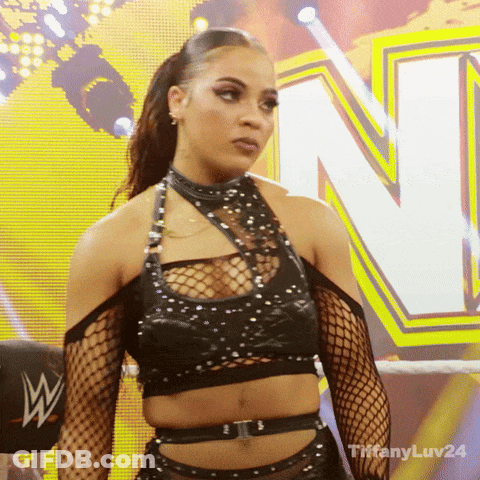 Woman In Black Crop Top And Fishnets By Yellow Sign N GIF