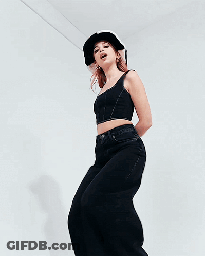 Woman In Black Crop Top And Jeans Dancing GIF