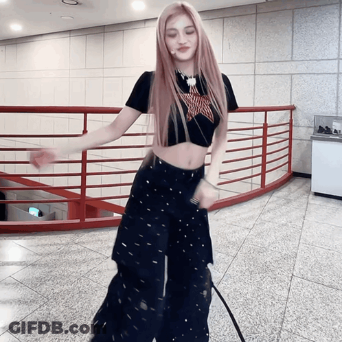Woman In Black Crop Top And Pants Dancing GIF