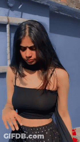 Woman In Black Crop Top And Polka Dot Skirt GIF