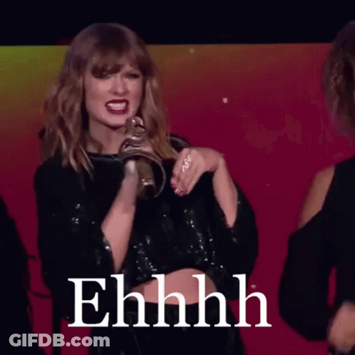 Woman In Black Crop Top With Ehhhh On Screen GIF