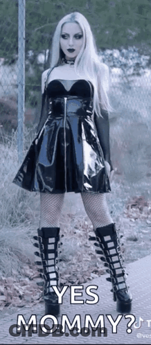 Woman In Black Dress And Boots Asking Yes Mommy GIF