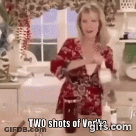 Woman In Black Dress And Bunny Ears Dancing While Man In White Suit Looks On GIF