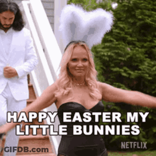 Woman In Black Dress And Bunny Ears Dancing While Man In White Suit Looks On GIF