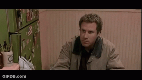 Woman In Black Dress And Earrings Making Funny Face Pointing GIF