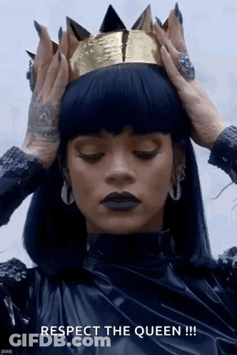 Woman In Black Dress And Gold Crown Holding Head GIF