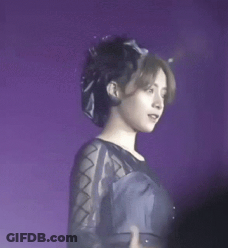 Woman In Black Dress And Hat On Stage GIF