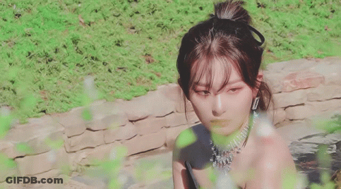 Woman In Black Dress And Necklace GIF