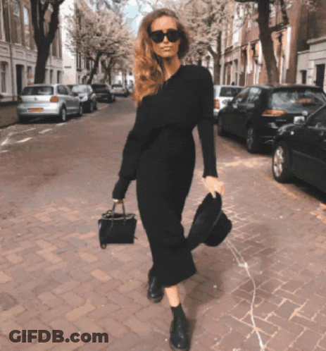 Woman In Black Dress And Sunglasses Walking GIF