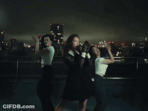 Woman In Black Dress And White Gloves Dancing With Two Women GIF