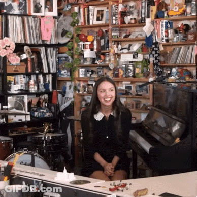 Woman In Black Dress At Piano GIF