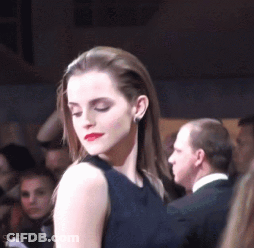 Woman In Black Dress Before Crowd GIF