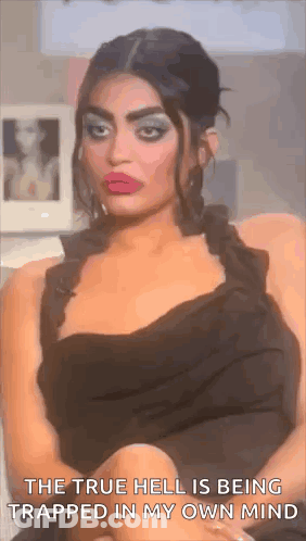 Woman In Black Dress Crosses Legs Says True Hell Trapped In My Own Mind GIF