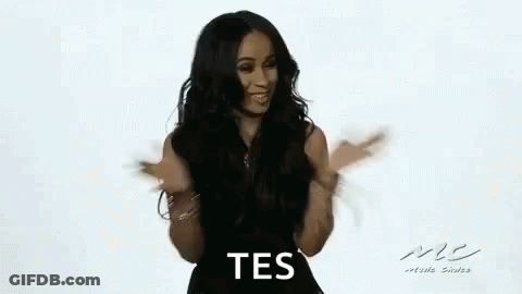 Woman In Black Dress Dancing And Smiling GIF
