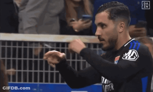 Woman In Black Dress Dancing In Stadium GIF