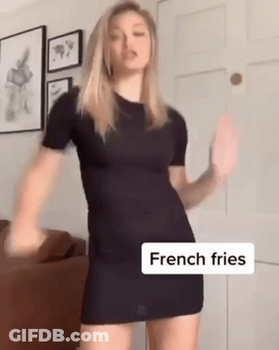 Woman In Black Dress Dancing With French Fries GIF
