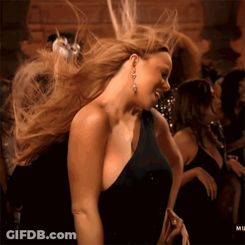 Woman In Black Dress Dancing With Hair Blowing GIF