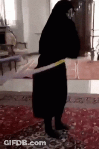 Woman In Black Dress Dancing With Hula Hoop GIF