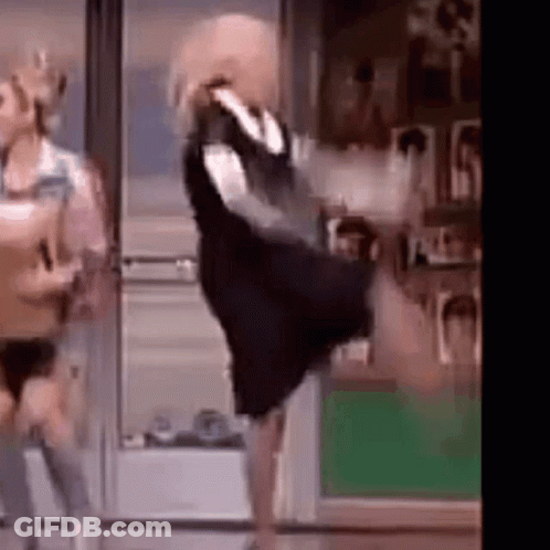 Woman In Black Dress Dancing With Man GIF