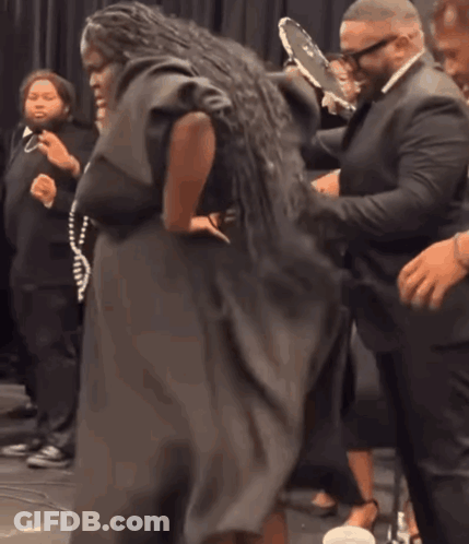 Woman In Black Dress Dancing With Man In White Shirt GIF