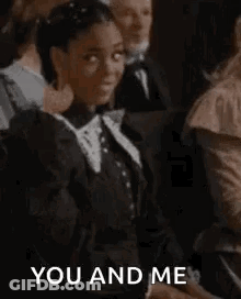 Woman In Black Dress Fist Bump To Crowd GIF