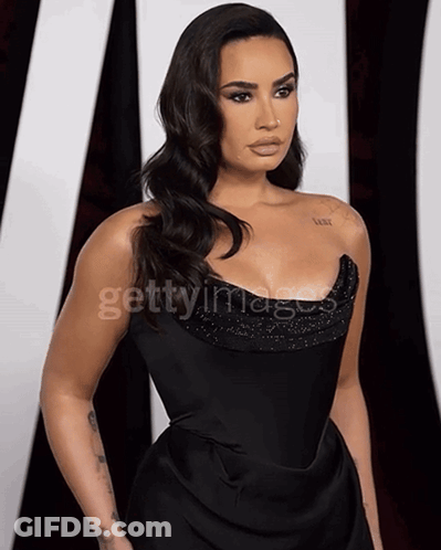 Woman In Black Dress Getty Images GIF