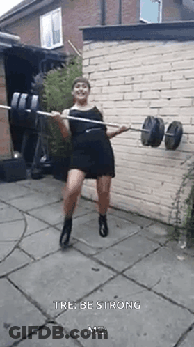 Woman In Black Dress Holding Barbell GIF