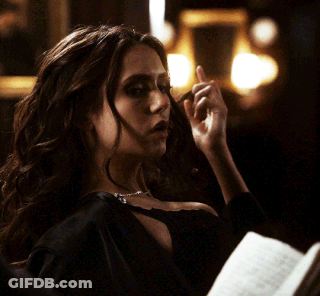 Woman In Black Dress Holding Book GIF