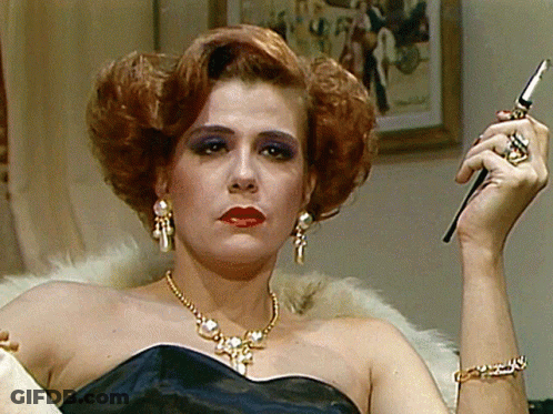 Woman In Black Dress Holding Cigarette GIF