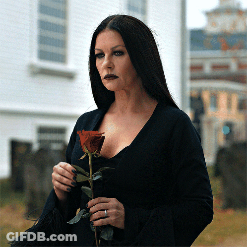Woman In Black Dress Holding Red Rose GIF