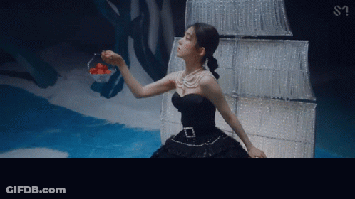 Woman In Black Dress Holding Strawberries GIF