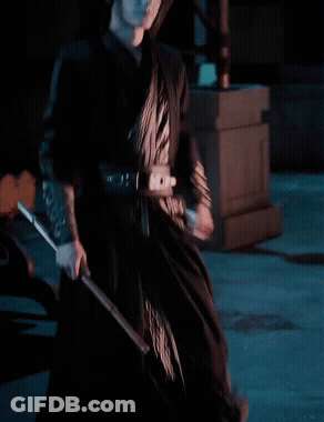 Woman In Black Dress Holding Sword GIF