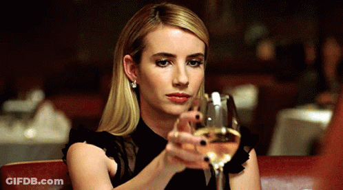 Woman In Black Dress Holding Wine GIF