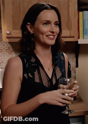 Woman In Black Dress Holding Wine Glass GIF