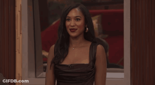 Woman In Black Dress In Front Of Live Sign GIF