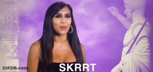 Woman In Black Dress In Front Of Statue Skrrt GIF