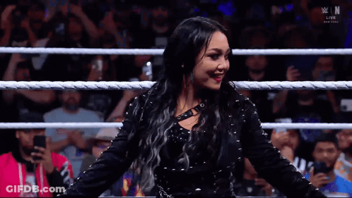 Woman In Black Dress In Wrestling Ring GIF