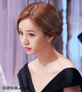 Woman In Black Dress Looking Serious GIF