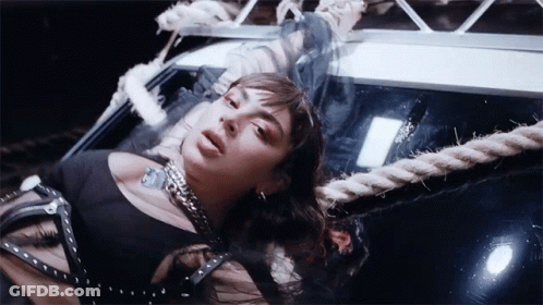 Woman In Black Dress Lying On Rope GIF