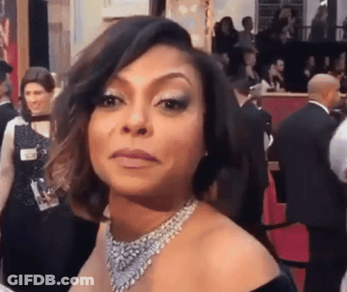Woman In Black Dress Making Face GIF