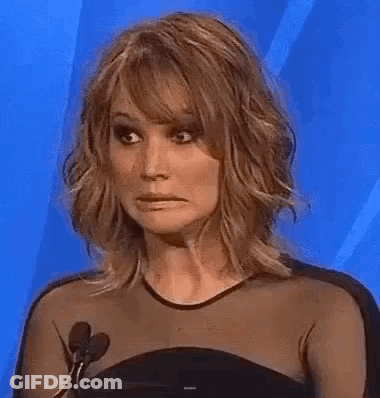 Woman In Black Dress Making Funny Face GIF