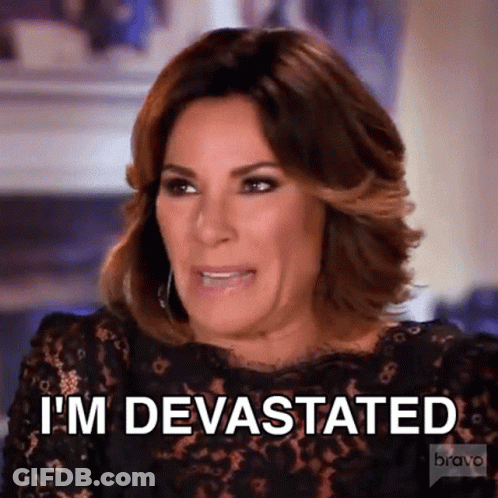 Woman In Black Dress Making Funny Face Saying I'm Devastated GIF