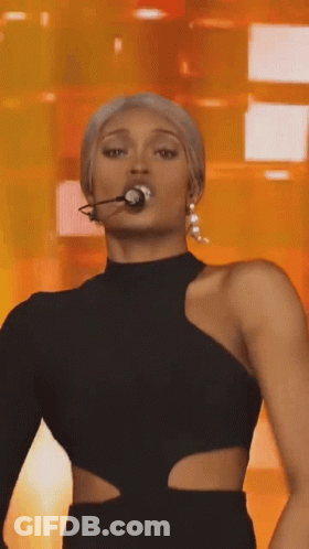 Woman In Black Dress Microphone In Mouth GIF